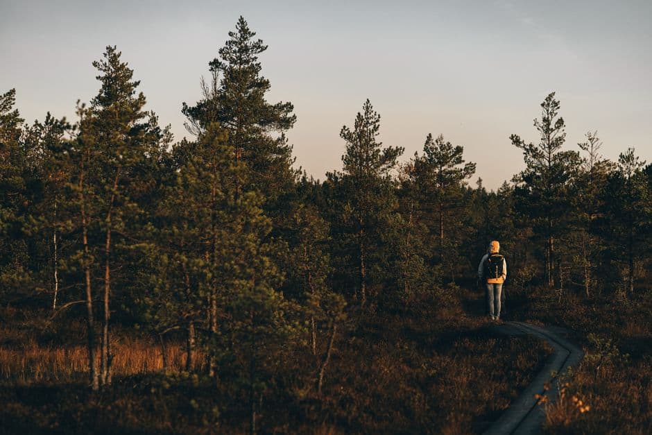 Person walking outdoors while returning to a regular habit