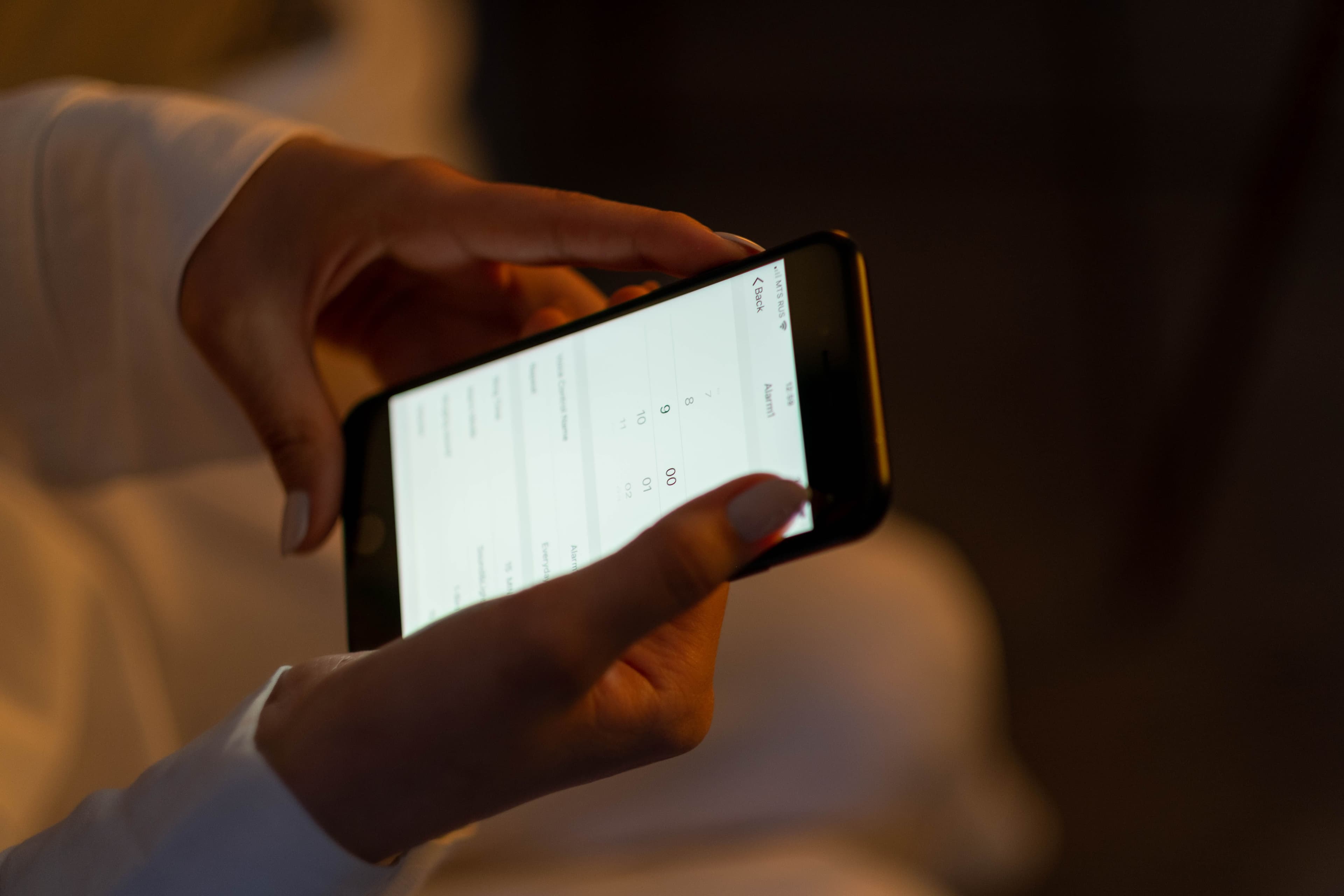 Person holding and using a smartphone